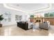 Bright living room with decorative fireplace, and neutral tile flooring at 4407 W Dale Ave, Tampa, FL 33609