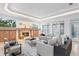 Elegant living room showcasing a carved fireplace, recessed lighting, and neutral furniture at 4407 W Dale Ave, Tampa, FL 33609