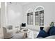 Bright living room with modern lighting, arched windows, neutral walls and stylish decor at 4407 W Dale Ave, Tampa, FL 33609