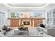 Bright living room featuring decorative fireplace, and neutral tile flooring at 4407 W Dale Ave, Tampa, FL 33609
