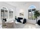 Bright living room with modern lighting, arched windows and stylish decor at 4407 W Dale Ave, Tampa, FL 33609