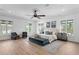 Large main bedroom with wood floors, sitting area, and plentiful natural light at 4407 W Dale Ave, Tampa, FL 33609