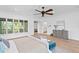 Spacious main bedroom with a ceiling fan, large windows, and hardwood flooring at 4407 W Dale Ave, Tampa, FL 33609