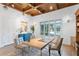 Well-lit office space featuring a large window, hardwood floors and stylish decor at 4407 W Dale Ave, Tampa, FL 33609