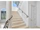 Elegant staircase with wrought iron railings at 4407 W Dale Ave, Tampa, FL 33609