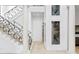 Elegant staircase with decorative wrought iron railings at 4407 W Dale Ave, Tampa, FL 33609
