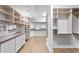 Large walk-in closet with custom storage shelving and hardwood floors at 4407 W Dale Ave, Tampa, FL 33609