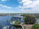 Aerial view of waterfront condo building with pool and boat slips at 4823 Ebbtide Ln # 403, Port Richey, FL 34668