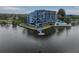 Waterfront condo building showcasing private balconies and boat dock access at 4823 Ebbtide Ln # 403, Port Richey, FL 34668