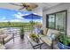 Relaxing balcony with outdoor furniture and water views at 4823 Ebbtide Ln # 403, Port Richey, FL 34668