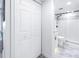Clean bathroom with a shower and toilet, white cabinets at 4823 Ebbtide Ln # 403, Port Richey, FL 34668