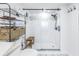Modern bathroom with a walk-in shower and marble flooring at 4823 Ebbtide Ln # 403, Port Richey, FL 34668