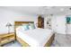 Spacious bedroom with king-size bed and ensuite bathroom access at 4823 Ebbtide Ln # 403, Port Richey, FL 34668