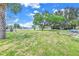 Landscaped common area with grassy lawn and marina views at 4823 Ebbtide Ln # 403, Port Richey, FL 34668