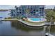 Condo building exterior showcasing balcony and waterfront location at 4823 Ebbtide Ln # 403, Port Richey, FL 34668