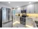 Bright kitchen with stainless steel appliances and marble countertops at 4823 Ebbtide Ln # 403, Port Richey, FL 34668