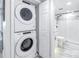 Stackable washer and dryer in a well-lit laundry room at 4823 Ebbtide Ln # 403, Port Richey, FL 34668