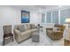 Cozy living area with sofa, recliner, and window seating at 4823 Ebbtide Ln # 403, Port Richey, FL 34668