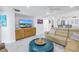 Living room with sectional sofa and built-in entertainment center at 4823 Ebbtide Ln # 403, Port Richey, FL 34668