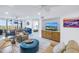 Bright living room with comfy seating, a large TV, and marble floors at 4823 Ebbtide Ln # 403, Port Richey, FL 34668