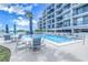 Inviting pool area with ample seating and a resort-like atmosphere at 4823 Ebbtide Ln # 403, Port Richey, FL 34668