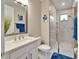 Modern bathroom with white vanity, quartz countertop, and a large walk-in shower at 4834 Tramanto Ln, Wesley Chapel, FL 33543