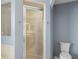 Bathroom includes a toilet and a shower stall at 5141 Courtland Rd, Spring Hill, FL 34608