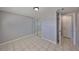 Bedroom with gray walls and mirrored closet doors at 6025 Florida S Cir, Apollo Beach, FL 33572