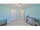 Light blue bedroom with closet and dresser at 6025 Florida S Cir, Apollo Beach, FL 33572