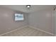 Simple bedroom with light gray walls and tile floor at 6025 Florida S Cir, Apollo Beach, FL 33572