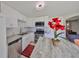 Modern kitchen with white cabinets and granite countertops at 6025 Florida S Cir, Apollo Beach, FL 33572