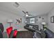 Spacious living room with comfy leather seating and ceiling fan at 6025 Florida S Cir, Apollo Beach, FL 33572