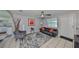 Living room with gray walls, leather couch, and ceiling fan at 6025 Florida S Cir, Apollo Beach, FL 33572