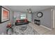 Living room with gray walls, leather couch, and ceiling fan at 6025 Florida S Cir, Apollo Beach, FL 33572