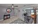 Open living room with gray walls, a rug and access to other rooms at 6025 Florida S Cir, Apollo Beach, FL 33572