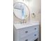 Vanity with quartz countertop and white cabinets in a small bathroom at 6145 Sun Blvd # 103, St Petersburg, FL 33715