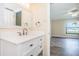 Modern bathroom with white vanity and quartz countertop at 6145 Sun Blvd # 103, St Petersburg, FL 33715