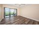 Bedroom with sliding glass doors leading to balcony at 6145 Sun Blvd # 103, St Petersburg, FL 33715