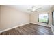 Spacious bedroom with large window and wood-look floors at 6145 Sun Blvd # 103, St Petersburg, FL 33715