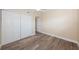 Bedroom with wood-look flooring and double closets at 6145 Sun Blvd # 103, St Petersburg, FL 33715