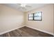 Bright bedroom featuring wood-look floors and large window at 6145 Sun Blvd # 103, St Petersburg, FL 33715