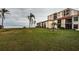 Building exterior with waterfront views and lush landscaping at 6145 Sun Blvd # 103, St Petersburg, FL 33715