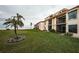 Condo building showcasing water views and lush lawn at 6145 Sun Blvd # 103, St Petersburg, FL 33715