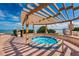 Relaxing hot tub under a shaded pergola with water views at 6145 Sun Blvd # 103, St Petersburg, FL 33715