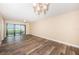 Bright living room with water view, and wood-look floors at 6145 Sun Blvd # 103, St Petersburg, FL 33715