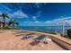 Spacious waterfront patio with lounge chairs for relaxing at 6145 Sun Blvd # 103, St Petersburg, FL 33715