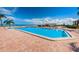 Community pool area with water views and lounge chairs at 6145 Sun Blvd # 103, St Petersburg, FL 33715