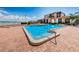 Inviting community pool with patio and water view at 6145 Sun Blvd # 103, St Petersburg, FL 33715