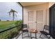 Waterfront view from a screened porch with seating at 6145 Sun Blvd # 103, St Petersburg, FL 33715
