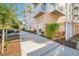 Sidewalk view of building entrance with manicured landscaping and decorative plants at 644 3Rd S Ave # 305, St Petersburg, FL 33701